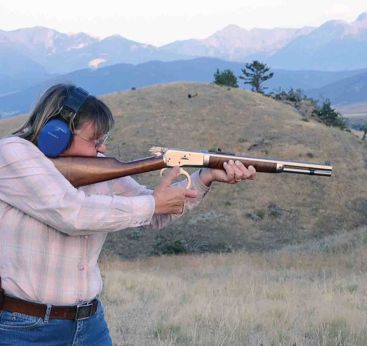 After years of cowboy action competition, Yvonne learned to operate a lever-action rifle with it shouldered.